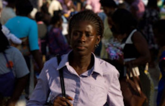 A woman walking in a crowd